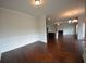 Open floor plan with hardwood, chair rails, and view into kitchen and living room at 2522 Bear Mountain St, Lithonia, GA 30058