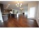 Open layout featuring kitchen, living, and dining areas with hardwood floors at 2522 Bear Mountain St, Lithonia, GA 30058