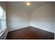 Clean, bright space with hardwood floors, white walls, decorative molding, and window at 2522 Bear Mountain St, Lithonia, GA 30058