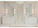 Bright bathroom featuring a double vanity with decorative mirrors and light fixtures at 27 Maddox Ne Dr, Atlanta, GA 30309