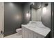 Stylish bathroom featuring a gray wall color, with a marble countertop vanity and modern lighting at 27 Maddox Ne Dr, Atlanta, GA 30309