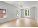 Bright bedroom features two large windows, hardwood flooring, and soft white walls at 27 Maddox Ne Dr, Atlanta, GA 30309