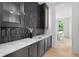 Elegant butler pantry with marble countertops and custom cabinetry at 27 Maddox Ne Dr, Atlanta, GA 30309