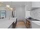 Gourmet kitchen with stainless steel appliances, marble countertops, and custom cabinetry at 27 Maddox Ne Dr, Atlanta, GA 30309