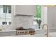 Gourmet kitchen with stainless steel appliances, marble countertops, and designer finishes at 27 Maddox Ne Dr, Atlanta, GA 30309