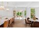 Elegant kitchen with large island, marble countertops, pendant lighting, and view to the outdoors at 27 Maddox Ne Dr, Atlanta, GA 30309