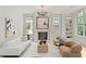 Stylish living room with contemporary decor, a fireplace, and built-in shelving at 27 Maddox Ne Dr, Atlanta, GA 30309
