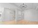 Open-concept living room featuring a modern chandelier and hardwood floors at 27 Maddox Ne Dr, Atlanta, GA 30309