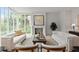 Bright living room with hardwood floors, large windows and a modern fireplace at 27 Maddox Ne Dr, Atlanta, GA 30309