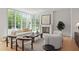 Bright living room with hardwood floors, large windows and a modern fireplace at 27 Maddox Ne Dr, Atlanta, GA 30309