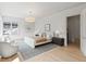 Spacious main bedroom featuring hardwood floors, a large window and a sitting area at 27 Maddox Ne Dr, Atlanta, GA 30309