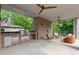 Covered patio with an outdoor kitchen, fireplace and seating area at 27 Maddox Ne Dr, Atlanta, GA 30309