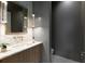 Chic powder room with stylish lighting, a marble sink and tile flooring at 27 Maddox Ne Dr, Atlanta, GA 30309