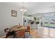 Bright dining area adjacent to the kitchen featuring hardwood floors and access to a patio at 576 Fraser Se St, Atlanta, GA 30312