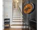 Inviting entryway with staircase, light hardwood floors, and Summerhill Estates sign at 576 Fraser Se St, Atlanta, GA 30312