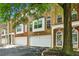Charming brick townhome featuring a two-car garage, and a covered entryway at 576 Fraser Se St, Atlanta, GA 30312