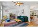Cozy living room with a ceiling fan, bookshelf, and stylish decor at 576 Fraser Se St, Atlanta, GA 30312