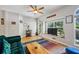 Inviting living room with a large window, hardwood floors, and a stylish bar cart at 576 Fraser Se St, Atlanta, GA 30312
