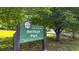 A shot of the Heritage Park sign with its park hours at 576 Fraser Se St, Atlanta, GA 30312