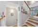 Stairway with wood treads, white risers and railing, and decorative wall art at 576 Fraser Se St, Atlanta, GA 30312