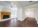 Finished basement with wood-look floors, a fireplace, and access to other rooms at 3125 Cardinal Lake Cir, Duluth, GA 30096