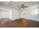 Spacious finished basement with wood-look floors and multiple closets for storage at 3125 Cardinal Lake Cir, Duluth, GA 30096