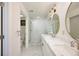 Bright bathroom featuring double sink vanity, decorative mirrors, modern lighting, and separate shower at 3125 Cardinal Lake Cir, Duluth, GA 30096