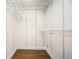 Walk-in closet features adjustable white wire shelving and modern wood flooring at 3125 Cardinal Lake Cir, Duluth, GA 30096