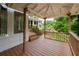 Deck area showcasing wood-stained railings, staircase, and a view of the water at 3125 Cardinal Lake Cir, Duluth, GA 30096