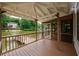 Deck area showcasing wood-stained railings and a view of the lake and dock at 3125 Cardinal Lake Cir, Duluth, GA 30096