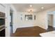 Cozy dining area featuring wood-look floors, a decorative light fixture, and plenty of natural light at 3125 Cardinal Lake Cir, Duluth, GA 30096