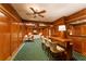 Entertaining bar with wood paneling, ceiling fan, and comfortable seating at 3450 Ridgewood Nw Rd, Atlanta, GA 30327