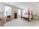 Inviting bedroom with canopy bed, two windows, two sitting chairs, and bright light at 3450 Ridgewood Nw Rd, Atlanta, GA 30327