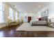 Large and spacious bedroom with hardwood floors, bright light, sitting area, and ensuite bathroom at 3450 Ridgewood Nw Rd, Atlanta, GA 30327