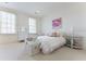 Charming bedroom with floral artwork, wicker furnishings and bright natural light from two large windows at 3450 Ridgewood Nw Rd, Atlanta, GA 30327