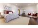 Spacious bedroom with sitting area, warm lighting, and sleek hardwood flooring at 3450 Ridgewood Nw Rd, Atlanta, GA 30327