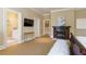 This bedroom features a cozy fireplace, tv, and ensuite bathroom for ultimate comfort and convenience at 3450 Ridgewood Nw Rd, Atlanta, GA 30327