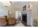 Elegant dining room featuring a fireplace and striped walls at 3450 Ridgewood Nw Rd, Atlanta, GA 30327