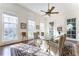 A sunlit dining room with large windows, neutral walls, and hardwood floors at 3450 Ridgewood Nw Rd, Atlanta, GA 30327