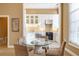 Eat-in kitchen area with a glass table, white cabinetry, and stainless appliances at 3450 Ridgewood Nw Rd, Atlanta, GA 30327