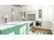 A gourmet kitchen featuring a large island, stainless steel appliances, and custom white cabinetry at 3450 Ridgewood Nw Rd, Atlanta, GA 30327