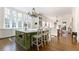 Spacious kitchen boasts an expansive island with seating, stainless appliances, and hardwood floors at 3450 Ridgewood Nw Rd, Atlanta, GA 30327