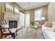 Cozy living room with fireplace, hardwood floors, neutral tones, and comfortable seating at 3450 Ridgewood Nw Rd, Atlanta, GA 30327