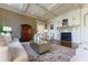 A formal living room with a fireplace, coffered ceilings, and hardwood floors at 3450 Ridgewood Nw Rd, Atlanta, GA 30327