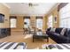 Bright living room with neutral tones, a dark blue sofa, and Zebra print accessories for a modern and cozy atmosphere at 3450 Ridgewood Nw Rd, Atlanta, GA 30327