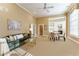 Open-concept living room featuring tall ceilings, neutral tones, and eat-in kitchen area at 3450 Ridgewood Nw Rd, Atlanta, GA 30327