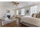 A serene main bedroom with a fireplace, hardwood floors, and neutral colors creates a relaxing retreat at 3450 Ridgewood Nw Rd, Atlanta, GA 30327