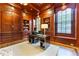 Luxurious wooden office space with built-in shelving, drawers, desk, and large windows for natural light at 3450 Ridgewood Nw Rd, Atlanta, GA 30327