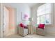 Cozy sitting area with bright window light, adjacent to bathroom with pink floral wallpaper at 3450 Ridgewood Nw Rd, Atlanta, GA 30327