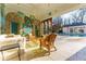 Sunroom with tile floor opens to pool and patio area at 3450 Ridgewood Nw Rd, Atlanta, GA 30327